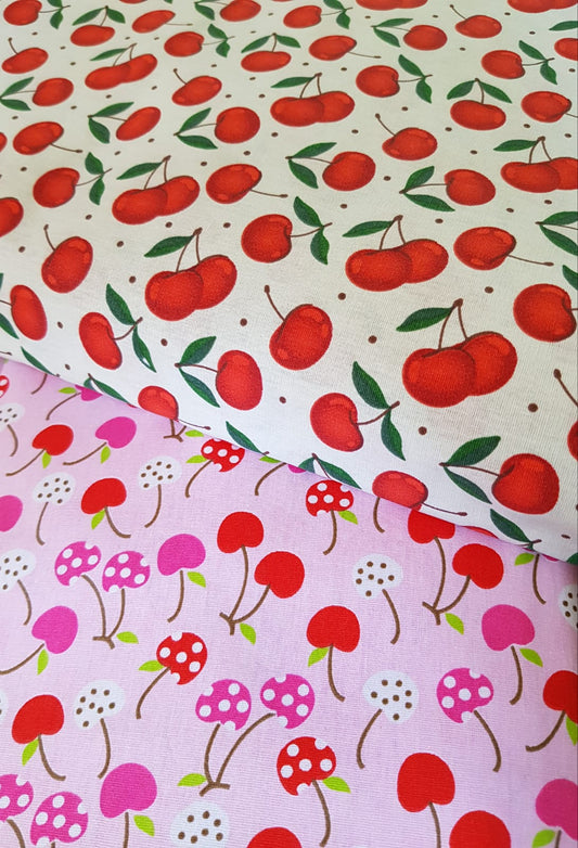 Frutales cerezas fondo rosa