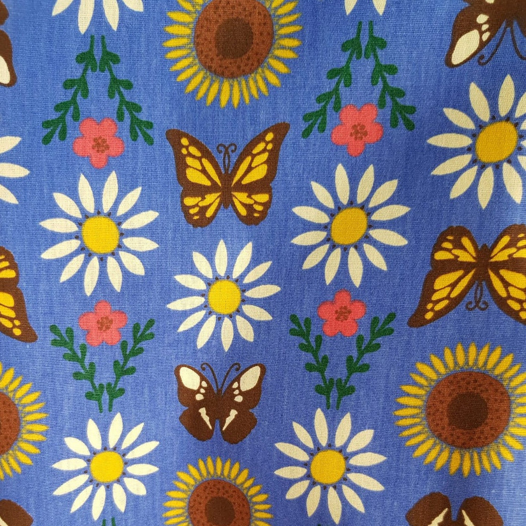 Mariposas y girasoles fondo azul